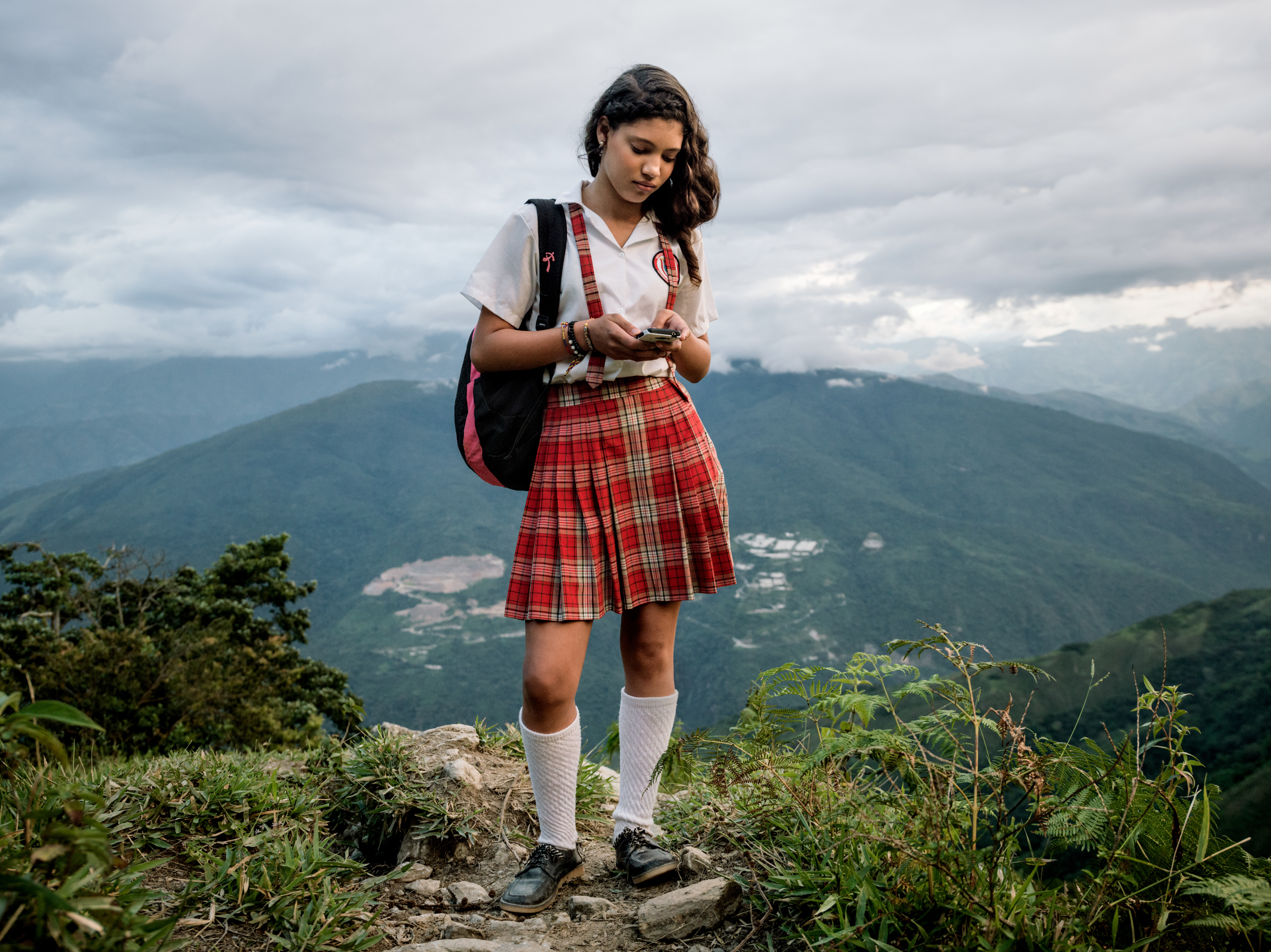 Alexandra Mazo, 12, with her cellphone on her way down the mountain after finishing school. 

Daily life in the remote mountain village of Pueblo Nuevo, an area that has been highly affected by the armed conflict and direct combat between the national army and the FARC-guerilla due to it's strategic location and the intensive production on coca-crops on the surrounding hillsides. The area is now dominated by FARC.