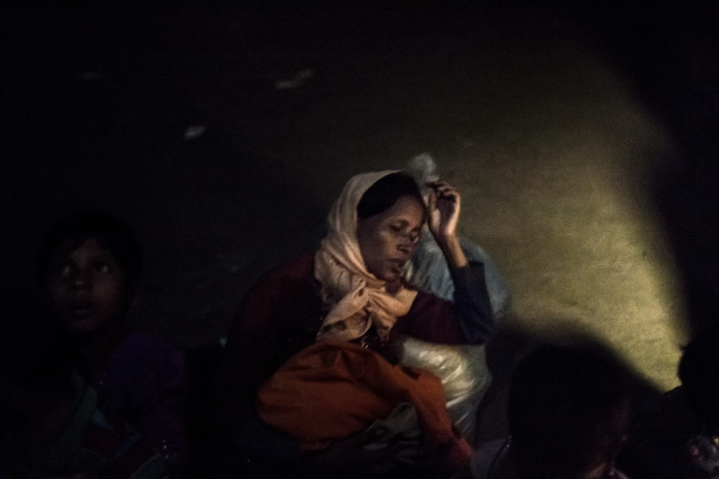 Anwara Bugum (33), a Rohingya muslim  refugee, lies exhausted on a beach on Shahpori island with her 6-days newborn baby after crossing the Naf river to flee violence in Myanmar. When Burmese soldiers attacked her village she managed to escape with her family, carried by her husband and hiding for ten days in the jungle, where she gave birth thanks to the help of some women. According to the UN more than 500,000 Rohingya, a stateless Muslim minority, have sought safety in Bangladesh, fleeing violence in Myanmar's Northern Rakhine state, after a new military crackdown started on 25 August 2017.