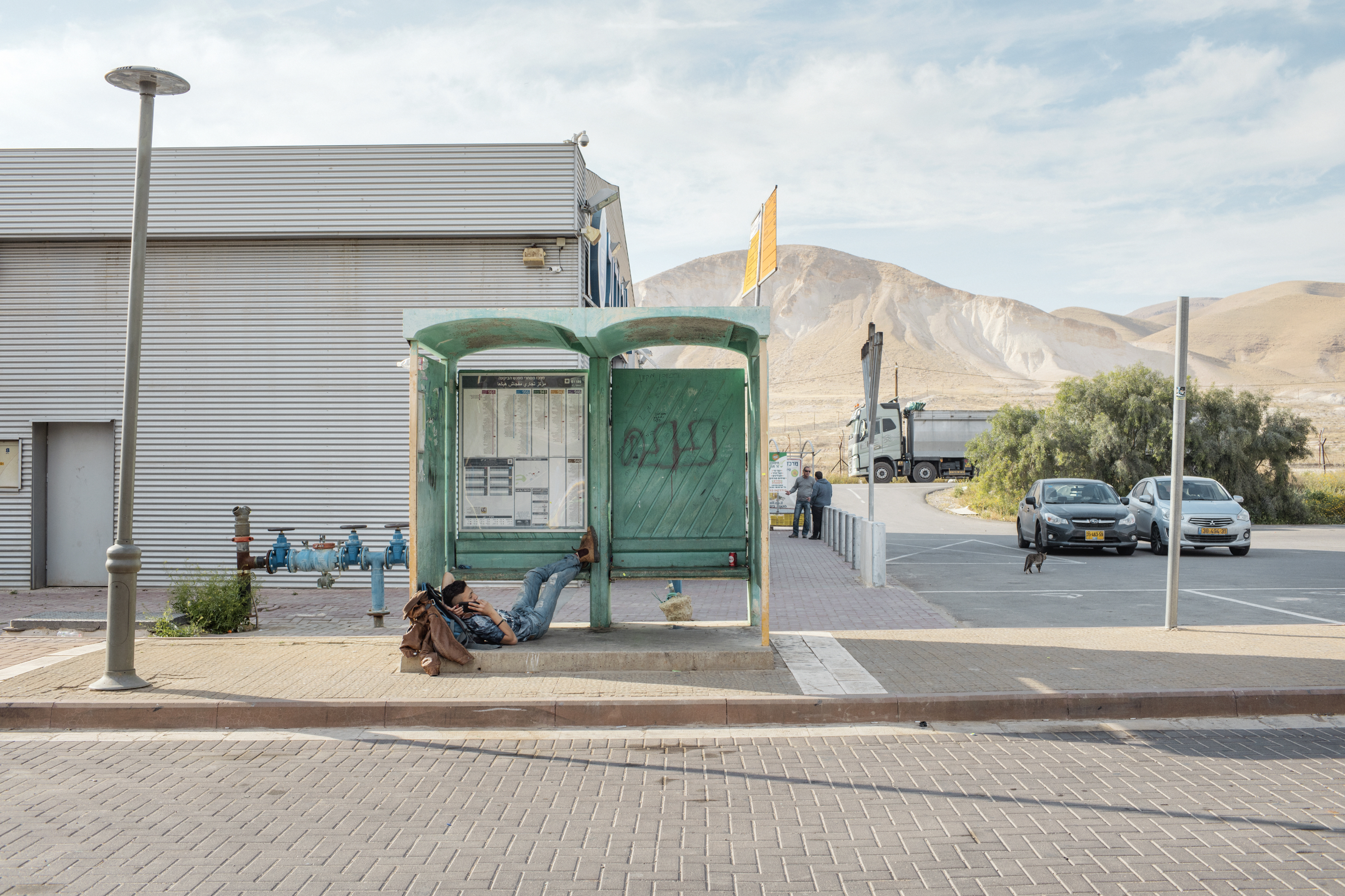010_Israeli-settlements_MAP_8749 A young Israeli settler at a bus stop in a rest area located on the Road 90, in the Jordan Valley, West Bank.