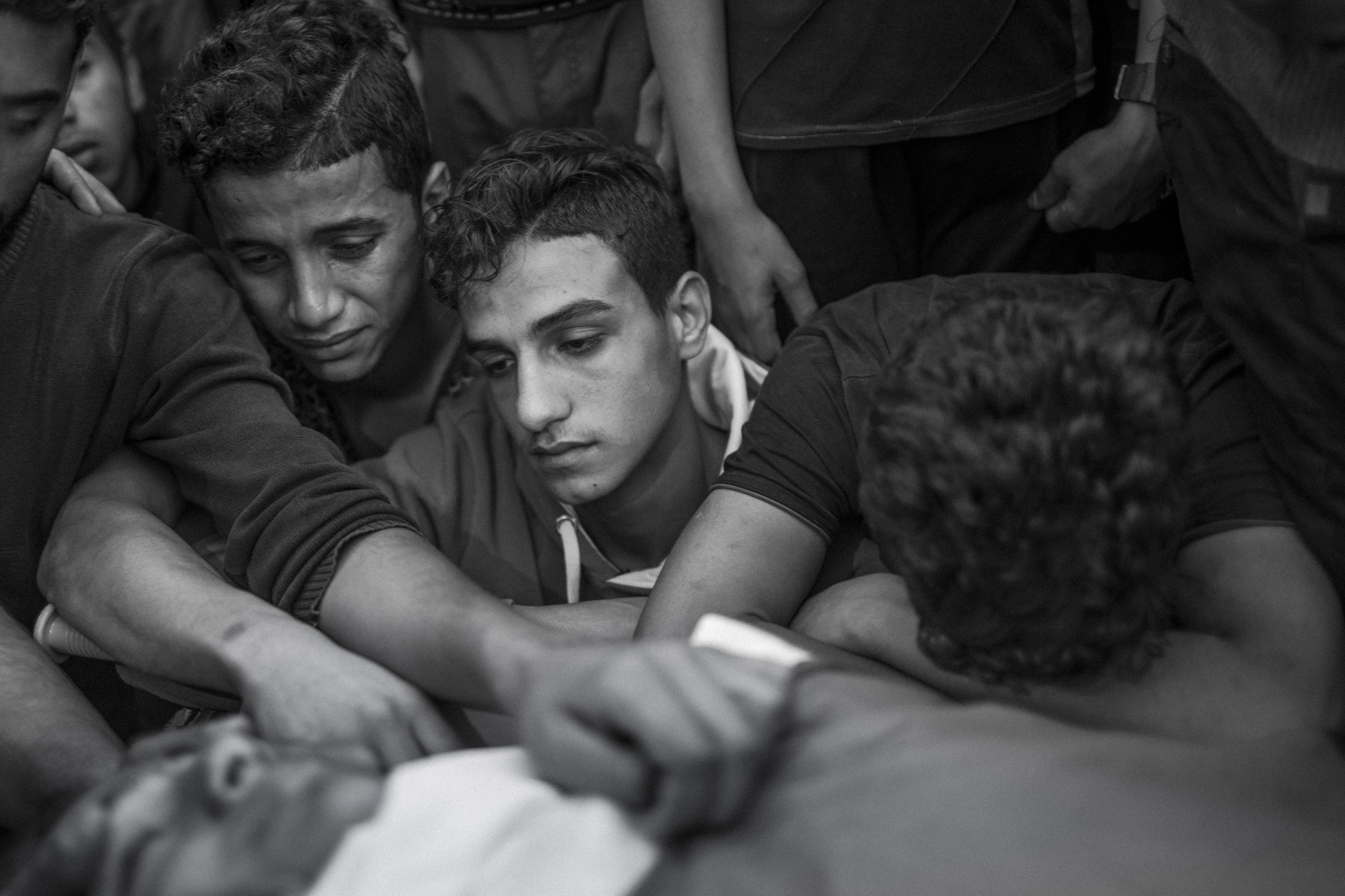 Gaza Strip, May 13, 2018. Brothers of 15-year-old Palestinian Jamal Afaneh mourn their beloved during his funeral in Rafah, Southern Gaza Strip, on 13 May 2018. The teenager died of his wounds after being shot by an Israeli sniper while partecipating at the  “Great March of Return”.