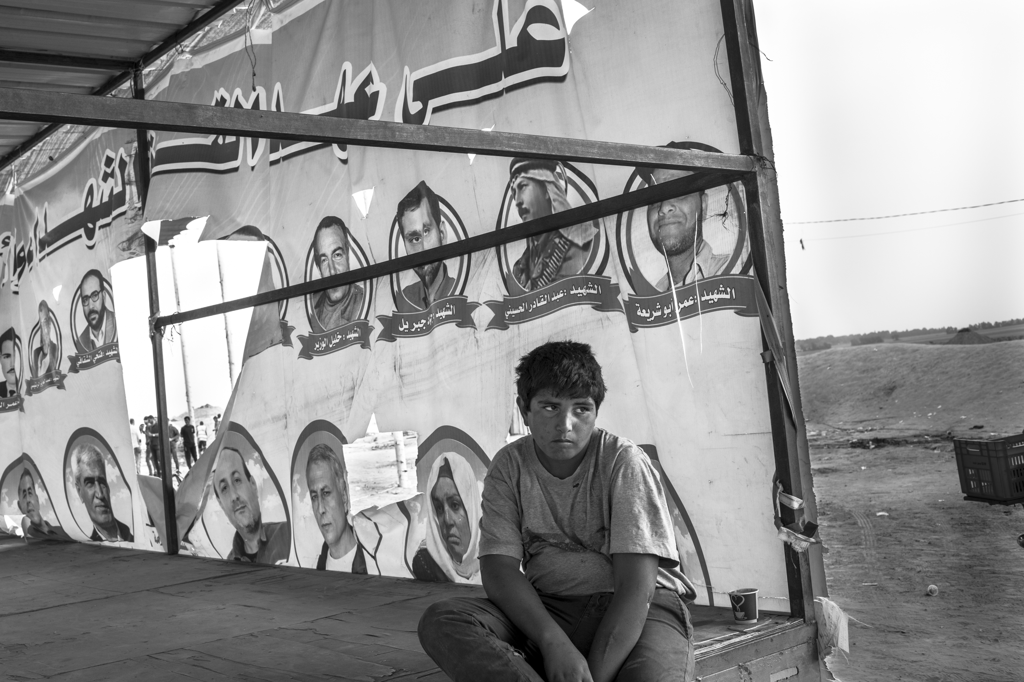Gaza Strip,  May 4, 2018. A young Palestinian sits on a stage set up in the center of the garrison of the Great March of Return, the Palestinian protest held along the Israeli-Gaza border.