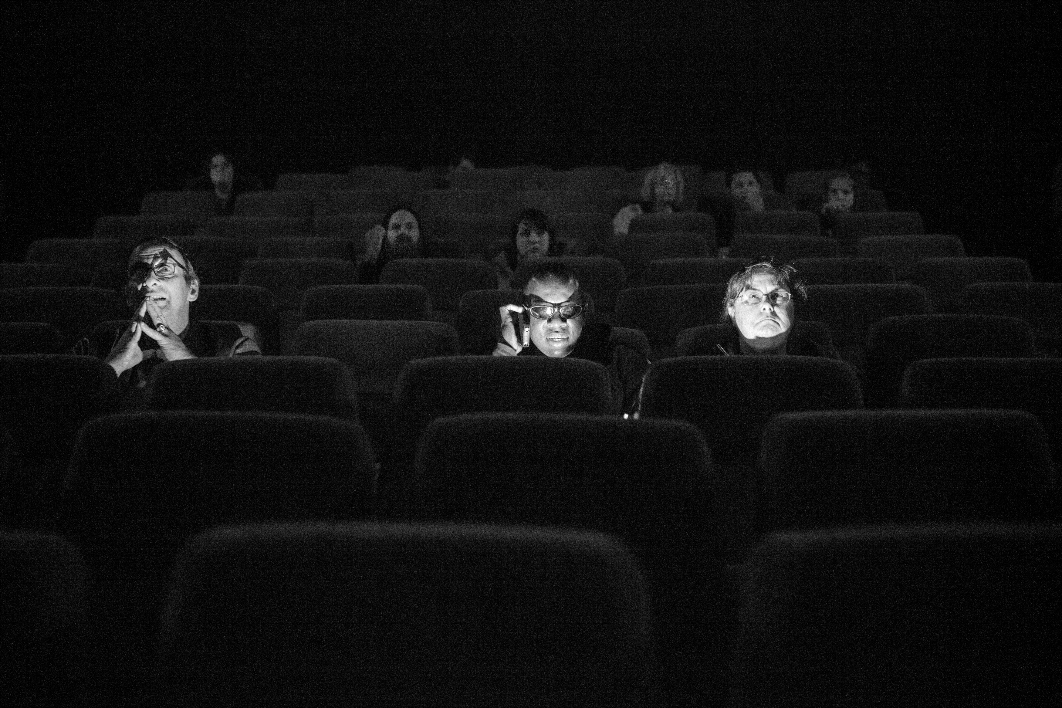 Robert Brown, Dale Layne and Cynda Bellamy at the movie theater before the beginning of Cloud Atlas. Robert recently became visually impaired, Dale , (on the phone) is completely blind, and Cynda, sighted, is the recreational specialist at World Services for the Blind. Although few movie theaters are equipped with bluetooth devices providing a description of the scenes for the blind, most of them are not, and they rely on the audio input from the movie and hints from the ones who are sitting with them. Action movies can be especially frustrating, for the presence of long action scenes with no dialogue and a powerful music, that necessarily require visual preception for spectators to follow the thread. Little Rock, Arkansas, January 5, 2013