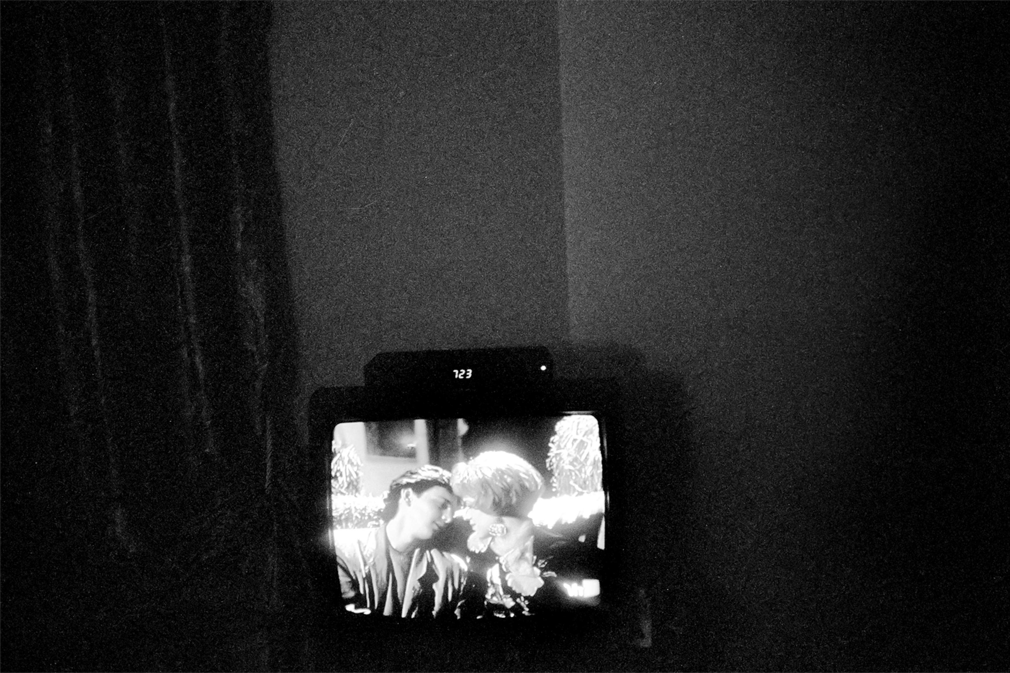 On a TV screen, two people look at each other. Apartment of Dale Layne. March 8, 2012