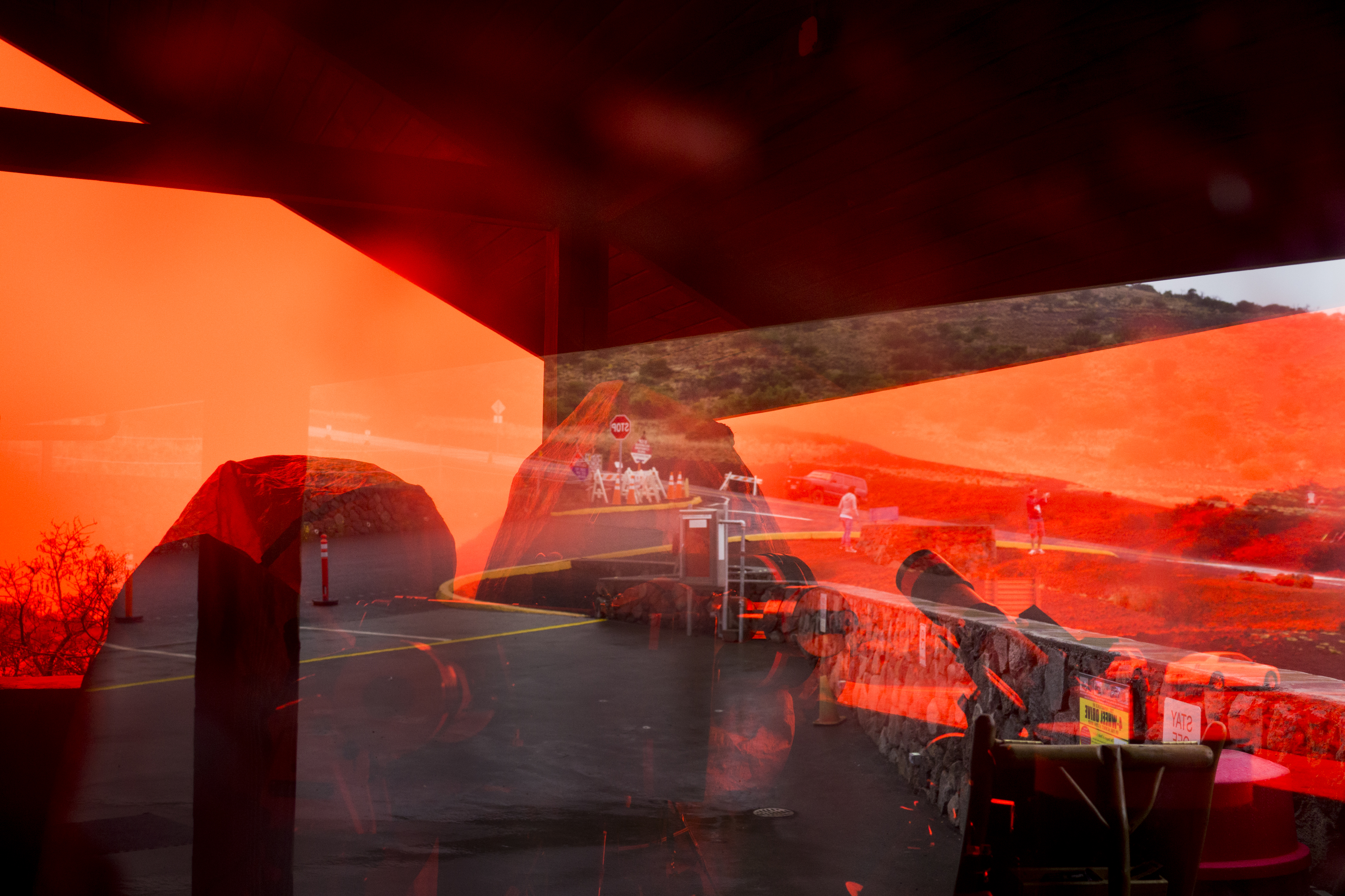 Slopes of volcano Mauna Kea are seen through the glass window of a star observatory on the mountain. Hawaii, Big Island. June 10, 2015.