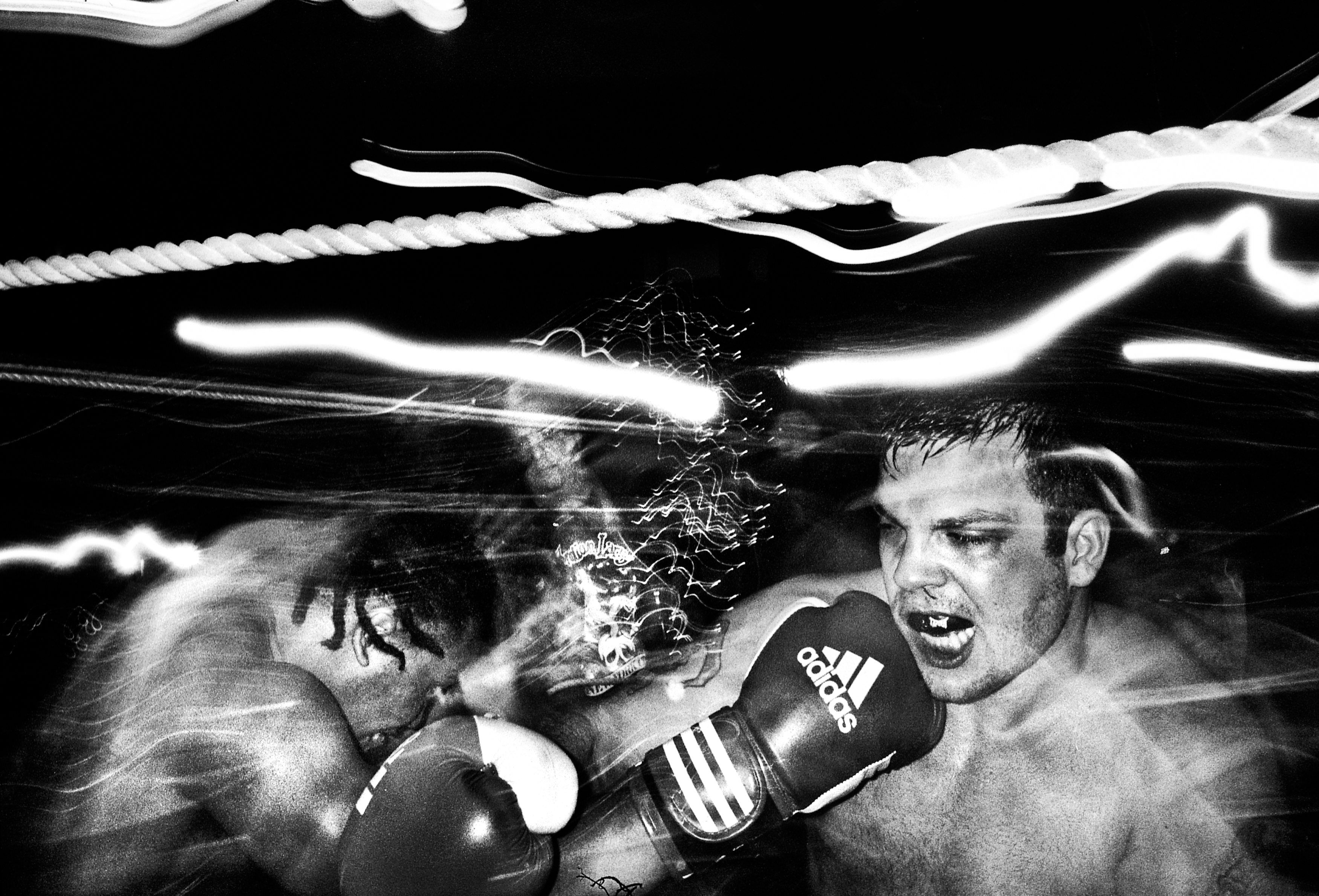 Anthony and other boxer connecting punches. (Old Fire House Soho, February, 2012)