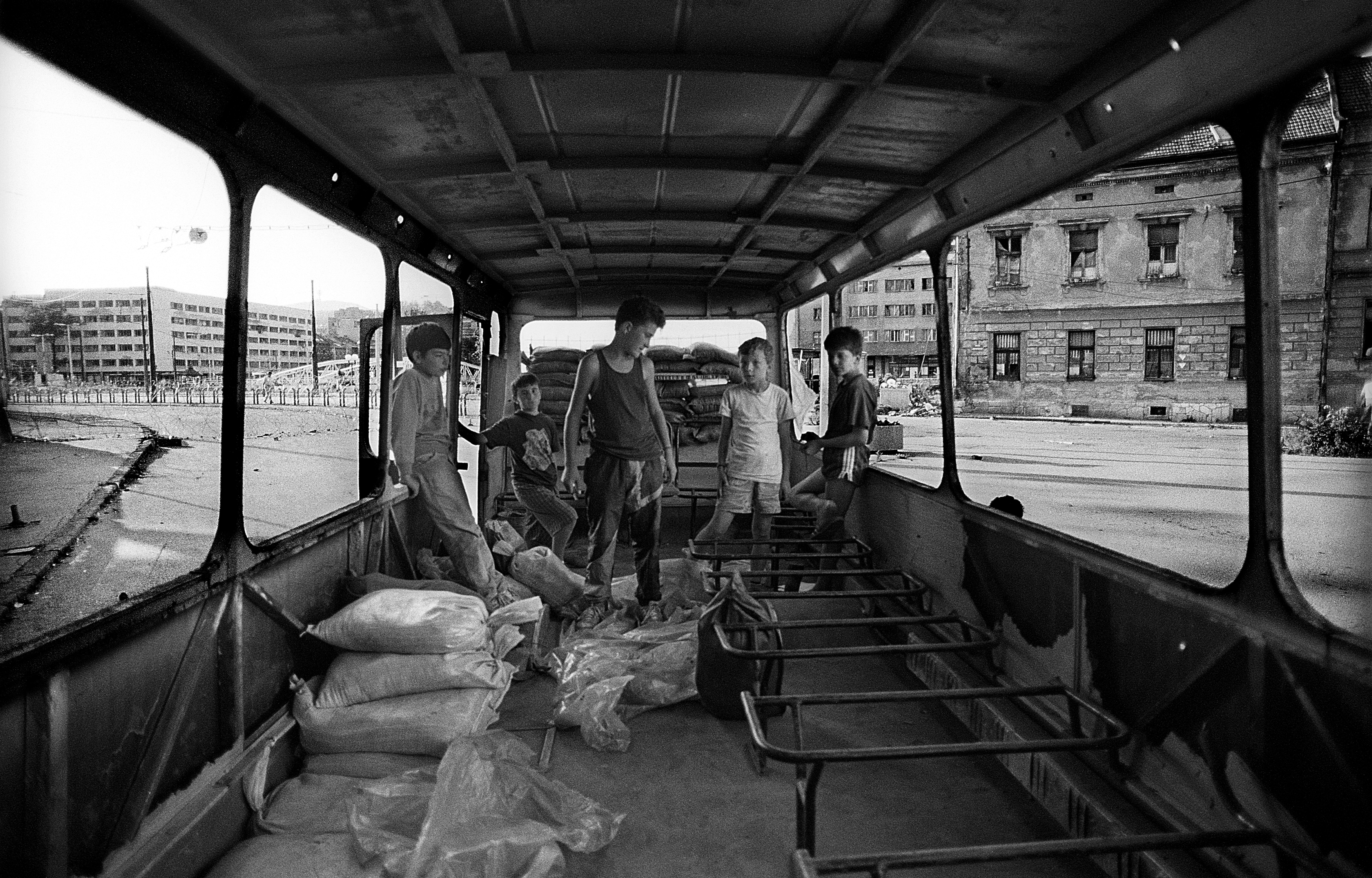 Sarajevo (Bosnia-Herzegovina) - August 1993
Some guys playing inside a destroyed bus close to the front line in the centre of Sarajevo