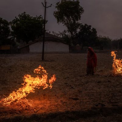 ****ATTN BETH FLYNN****FOR INDIA WATER PROJECT BY SOMINI SENGUPTA
TRAX: 30239640A
6/15/2019 Jugail, Uttar Pradesh, India. 
A woman burned dry husks to fertilize the land in Jugail, Uttar Pradesh in the hopes that the summer monsoon will bring rain to the region. 

Residents of the Chopan Block in Uttar Pradesh, about 120km south of Varanasi, used to grow Lentils and Mustard and other grains with the rainwater that fell and refreshed the small ponds amid forested hills that locals say were home to monkeys and wild pigs decades ago. Today, the district is red and brown parched landscape, with Mahua trees and their deep roots the only vegetation that stays green year round. Many locals have stopped planting crops all together because they know that the rains are no longer sufficient to support their crops. Those who do grow can plant just once a year, and they take longer to grow due to the lack of water. Handpumps for drinking water run dry in the summer months, forcing residents to walk ever greater distances to fill their buckets and jugs. The only thing sustaining the community, according to locals, is the money sent back from young villagers who have migrated to IndiaÕs rapidly expanding cities for work. 

India has always been subjected to the extremes of itÕs climate, cycling between periods of drought, and extreme rainfall brought on by the monsoon. However, as the climate warms, and the monsoons annual cycle is disrupted, those extremes are getting more severe, leading to prolonged droughts and heavier flooding across the countryÑthreatening IndiaÕs urban and rural areas alike. 
 
CREDIT: Bryan Denton For The New York Times